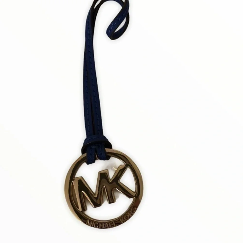 MICHAEL KORS blue leather gold tone hangtag
